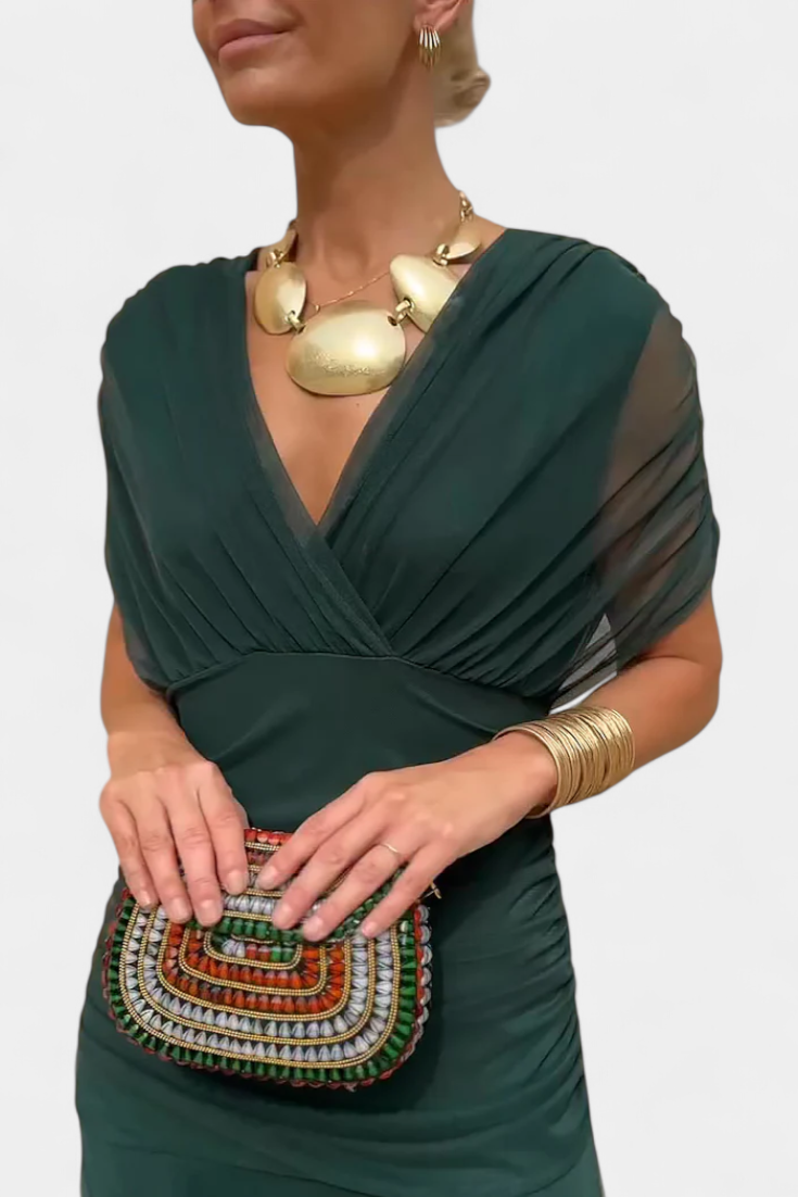 Eleganza pura con questo abito lungo donna, corpetto drappeggiato e scollo senza spalline. Ideale per sera.