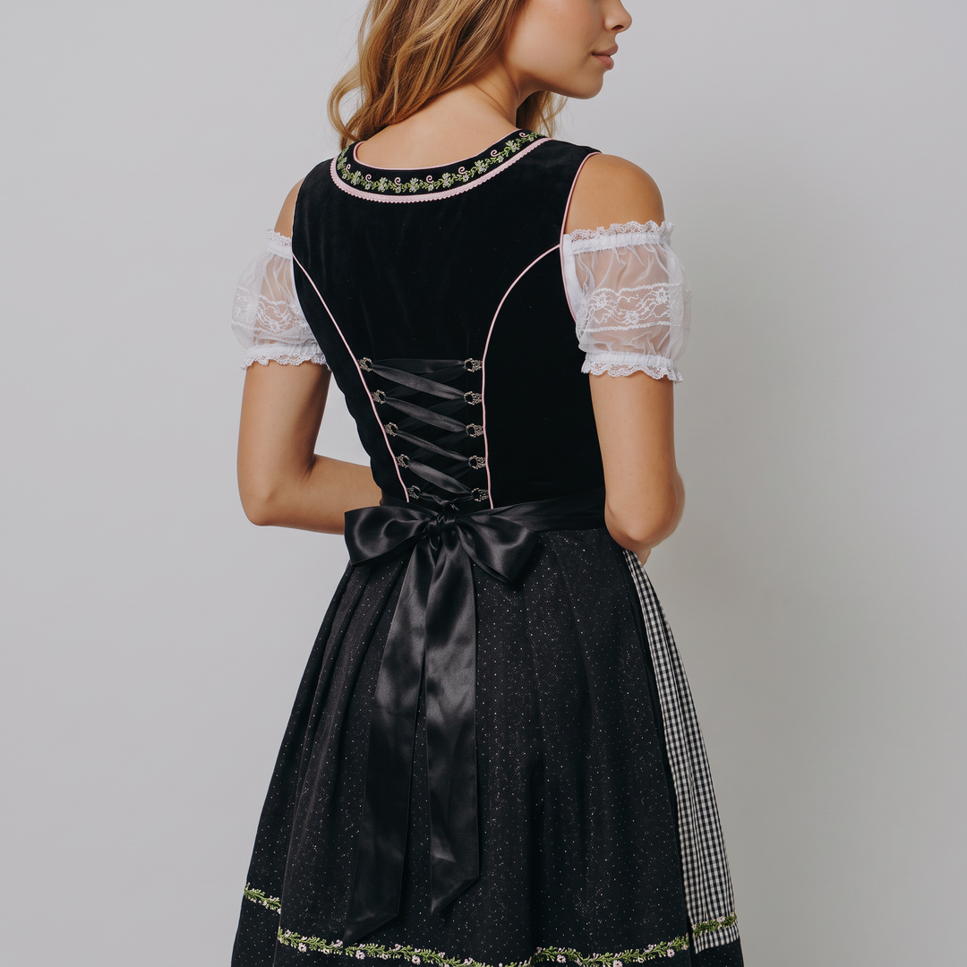 Donna che indossa un dirndl midi bavarese per l'Oktoberfest, vestito tradizionale elegante e festivo.