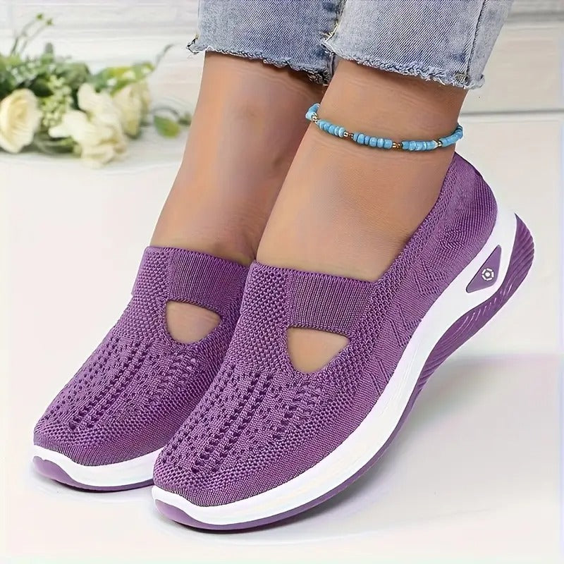 Sneakers da donna slip-on grigie, leggere e comode, ideali per attività casual e camminate.