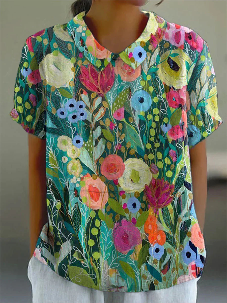 Camicetta floreale da donna multicolore con colletto e maniche corte. Ideale per outfit casual primavera/estate.