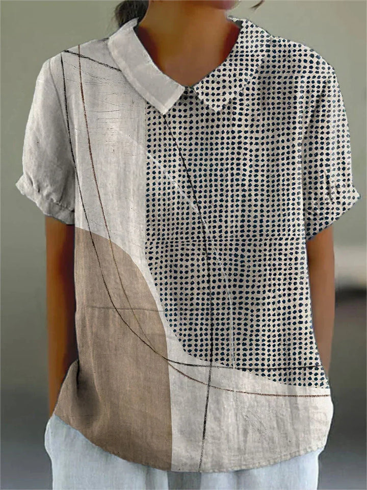 Elegante blusa floreale da donna con vestibilità comoda e maniche corte. Perfetta per la moda estiva e primaverile.