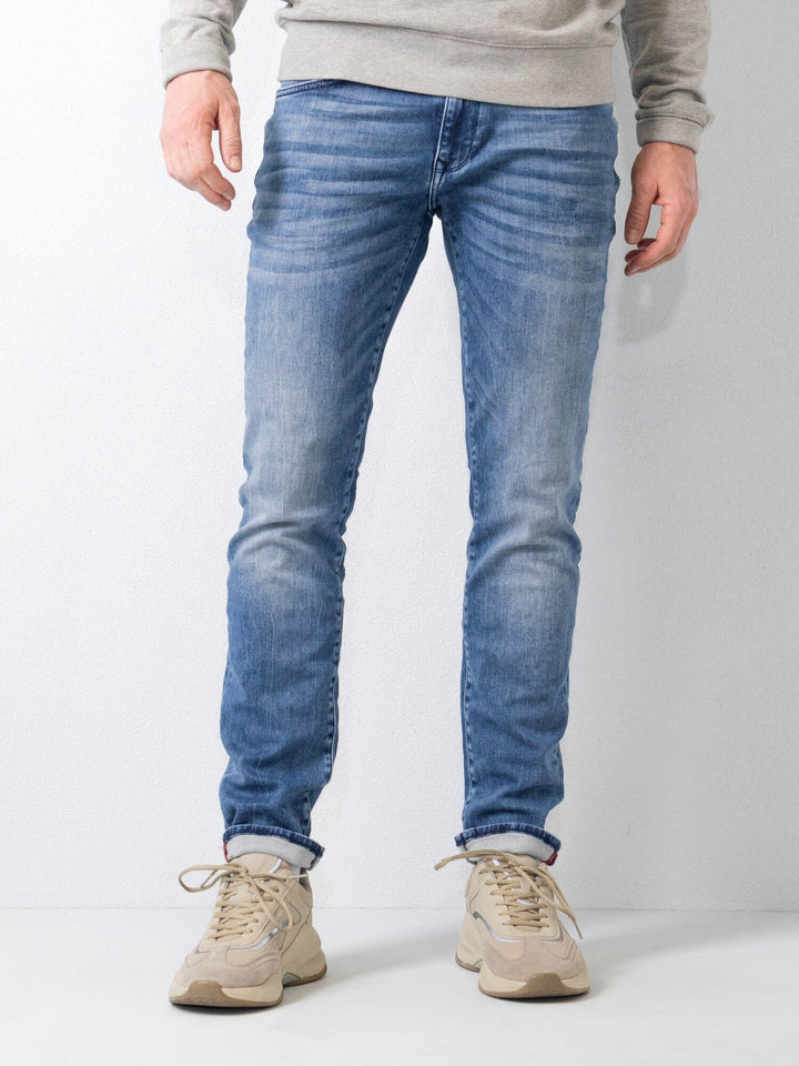 Jeans slim fit da uomo blu scuro, stile moderno e comfort quotidiano.