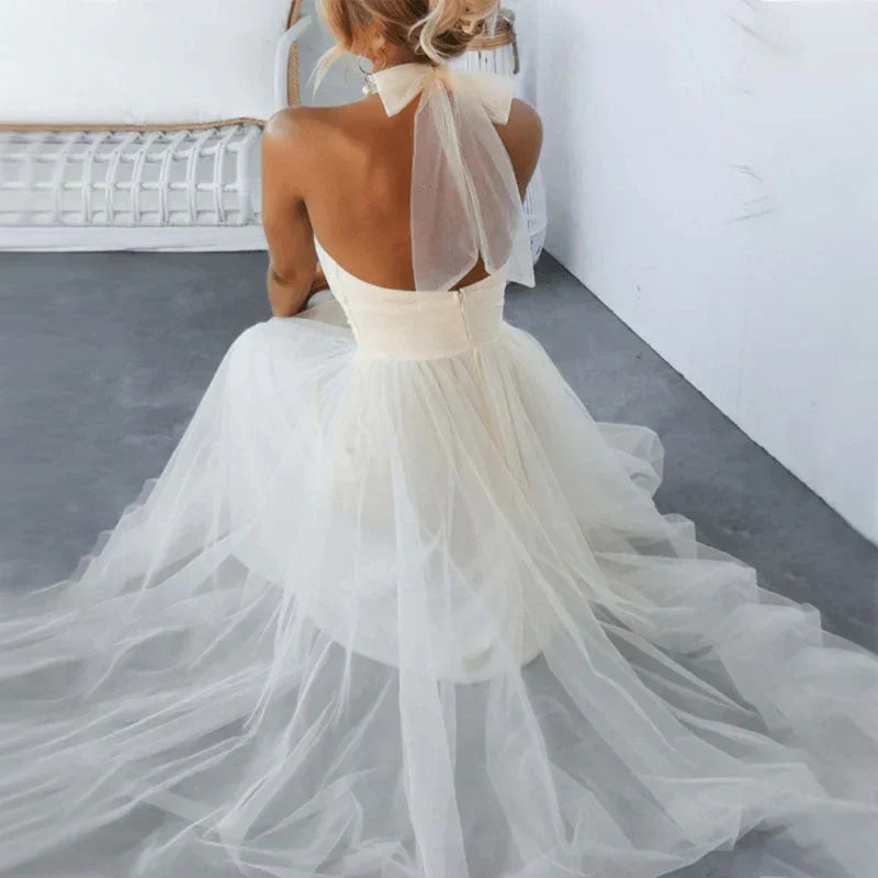 Abito donna per eventi, scollo all'americana, fluido e sofisticato, moda estiva.