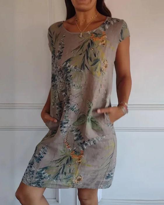 Abito da donna primavera-estate con scollo a V profondo e comode tasche, look versatile.