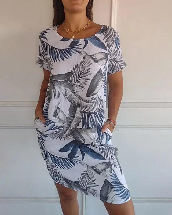 Vestito estivo leggero da donna, scollo a V e tasche, ideale per moda casual e comfort estivo.