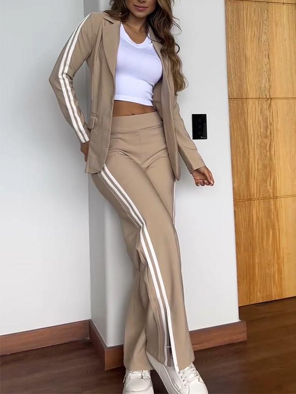 Moda donna: set due pezzi blazer e pantaloni a righe verticali, vestibilità rilassata e comoda.