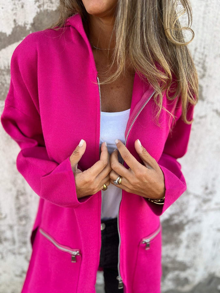 Cardigan lungo invernale da donna con cappuccio e zip, perfetto per il freddo autunnale.