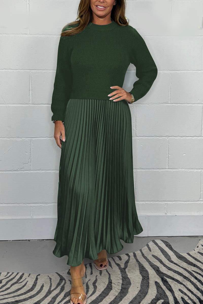 Modella indossa completo donna invernale: maglione in maglia e gonna plissé raso. Stile raffinato.