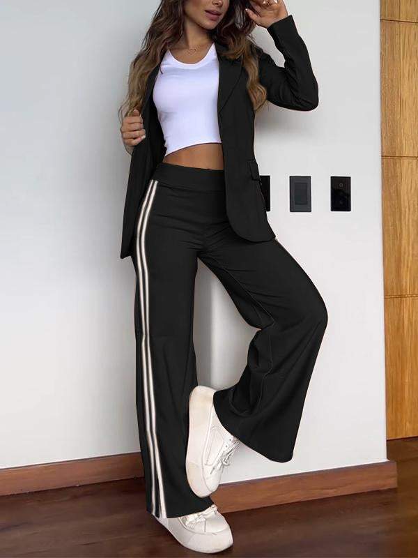 Set due pezzi donna: blazer e pantaloni a righe verticali, perfetto per un outfit da ufficio professionale.