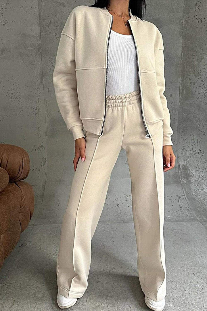 Completo donna casual due pezzi grigio, felpa oversize con zip e jogger comodi. Ideale per athleisure e relax.