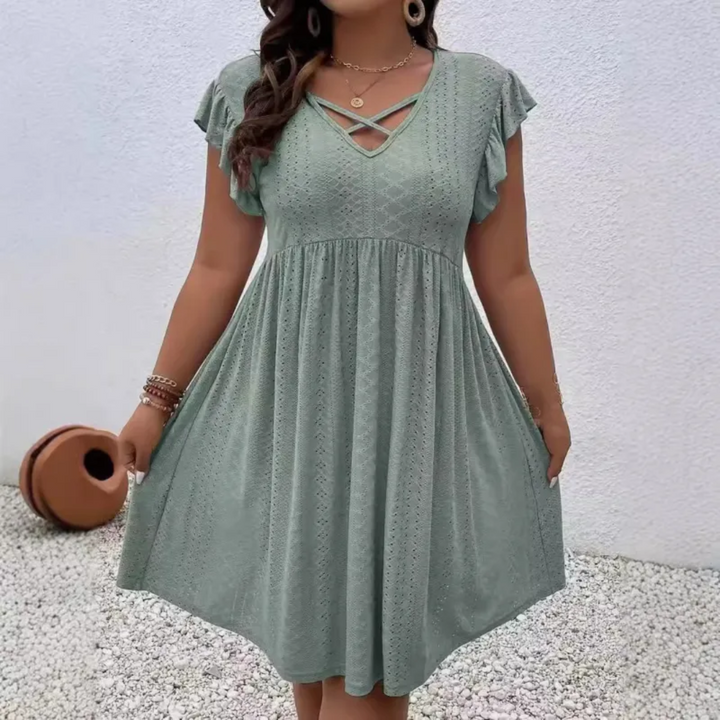 Abito estivo donna casual con scollo a V e maniche a volant. Perfetto per un look versatile e comodo quest'estate.
