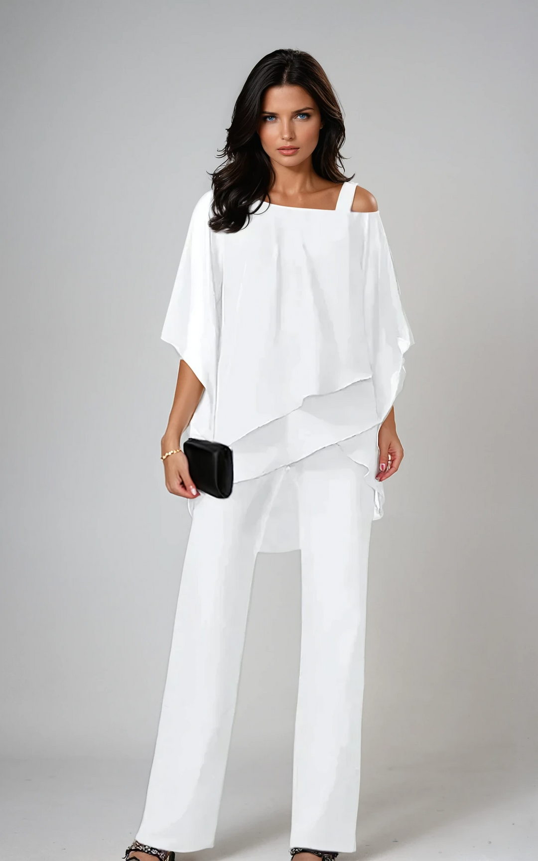 Completo coordinato elegante donna, top stratificato fluido e pantaloni, per un look raffinato e occasioni speciali.