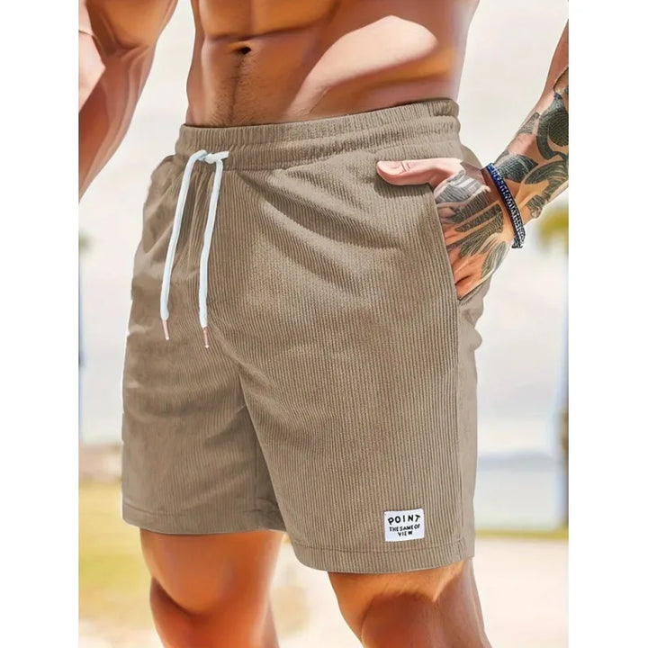Shorts uomo leggeri in tessuto traspirante con coulisse, perfetti per l'estate. Massima comodità garantita.