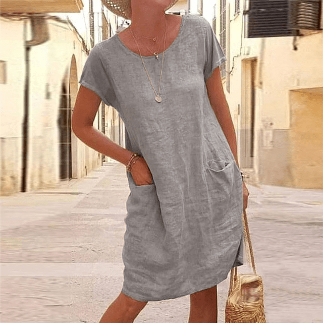 Abito midi estivo versatile in tessuto leggero per donna, con tasche laterali per il massimo comfort e stile.