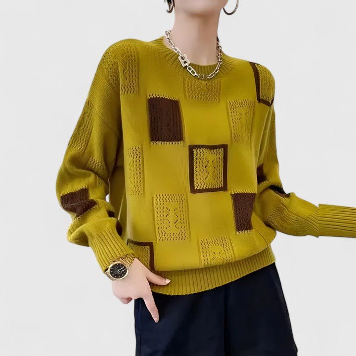 Maglione donna comodo a maglieria geometrica traforata, ideale per un look elegante e casual.