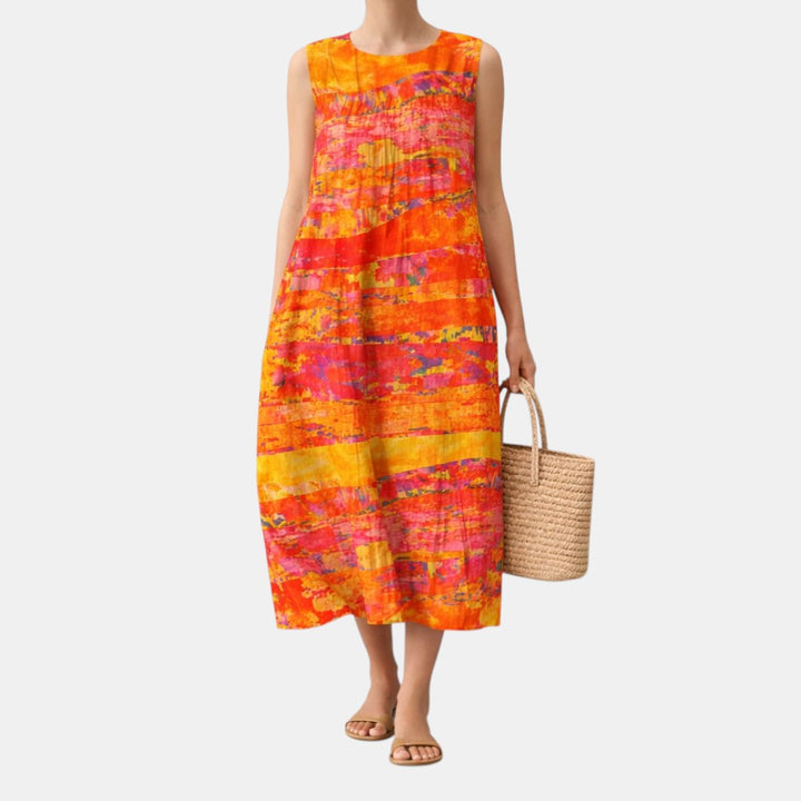Elegante abito midi smanicato da donna, con vivace stampa astratta solare, ideale per vacanze primaverili/estive.