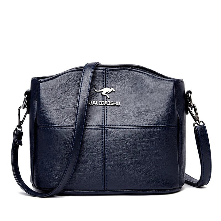 Borsa a mano in pelle verde bottiglia, versatile accessorio moda per donna.