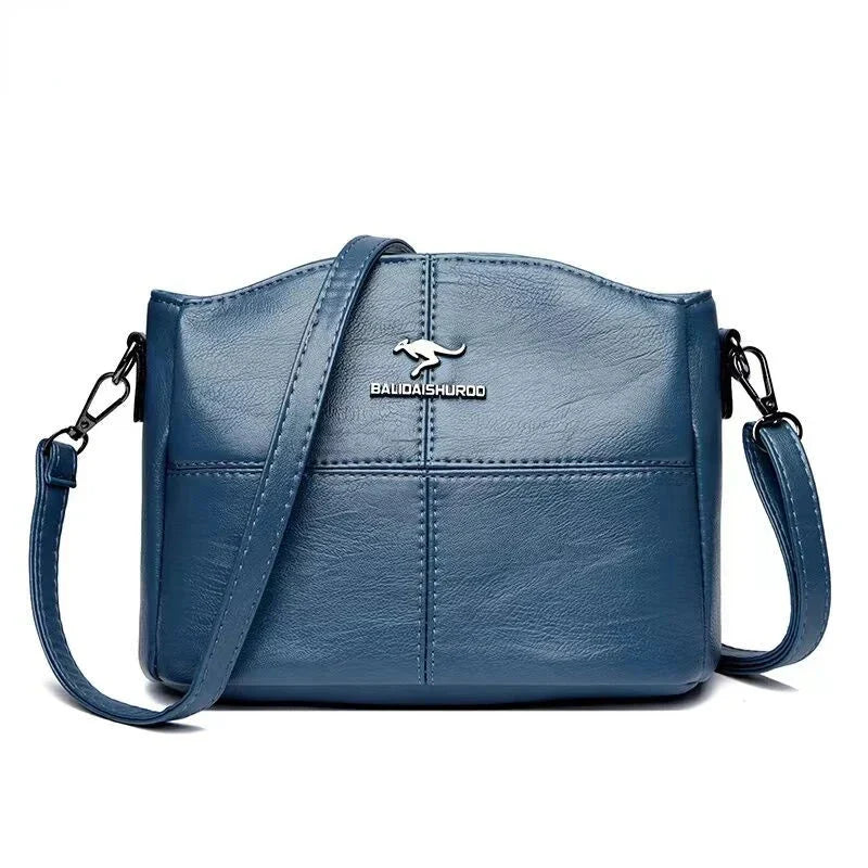 Borsa in pelle grigia da donna, spaziosa, stile classico, con tracolla removibile.