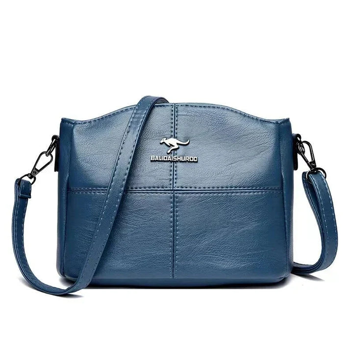 Borsa versatile in pelle beige, comoda e spaziosa per il quotidiano femminile.
