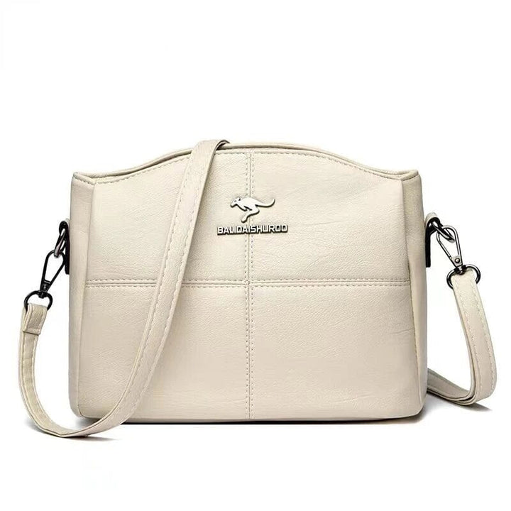 Borsa da donna in pelle, uso quotidiano, tracolla e manici, disponibile in vari colori.