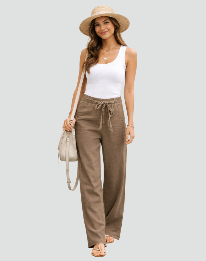 Vista posteriore pantaloni donna in lino a gamba larga, con dettaglio coulisse e tasche, ideali per l'estate.