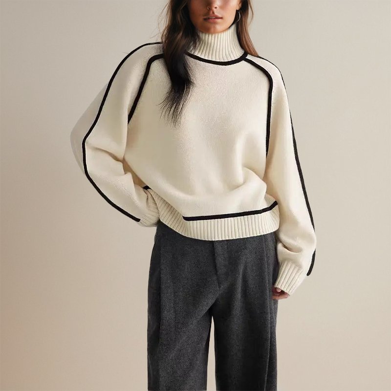 Maglieria donna: maglione dolcevita color block, caldo e stilosa. Essenziale per comfort invernale e moda casual.