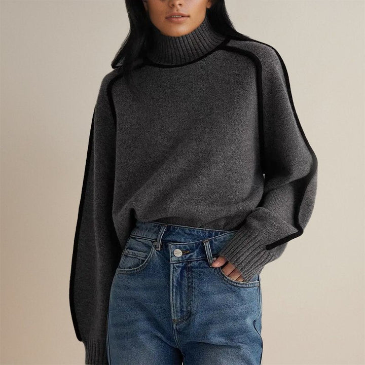 Maglione donna dolcevita a blocchi di colore per l'inverno. Caldo e accogliente, ideale per un look casual-elegante.