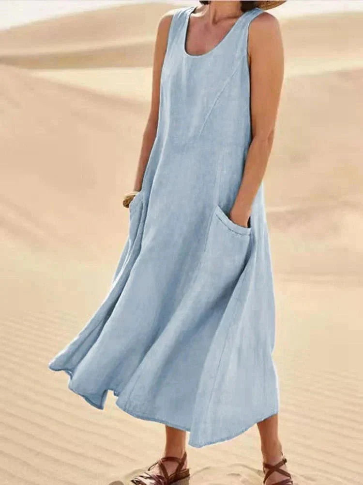 Vestito estivo donna fluido, senza maniche e scollo rotondo. Abito lungo comodo con tasche, perfetto per l'estate.