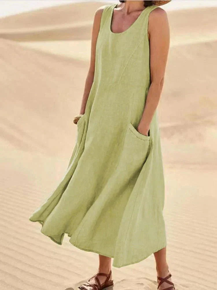 Vestito donna lungo, senza maniche, scollo rotondo. Maxi dress estivo casual con tasche, comodo e versatile.
