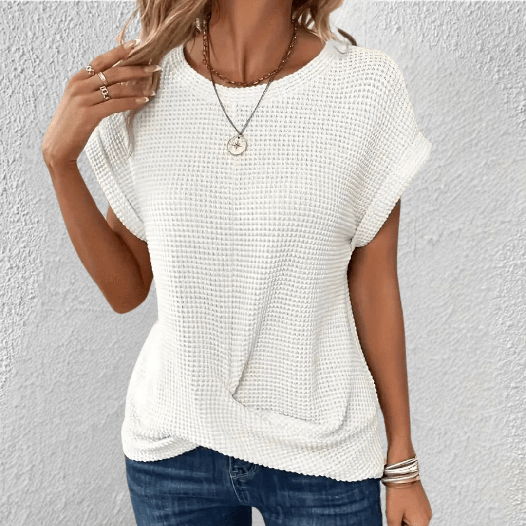 Camicetta donna manica lunga, scollo rotondo e trama unica. Ideale per uno stile versatile e moderno.