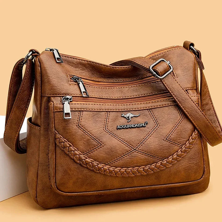 Elegante borsa a tracolla da donna in vera pelle morbida. Perfetta per un look casual o raffinato.