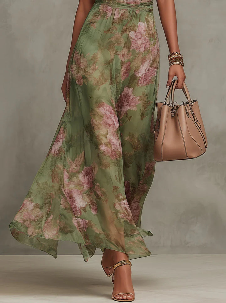 Abito floreale lungo da donna con scollo halter, look elegante e moderno per eventi e cerimonie autunnali.