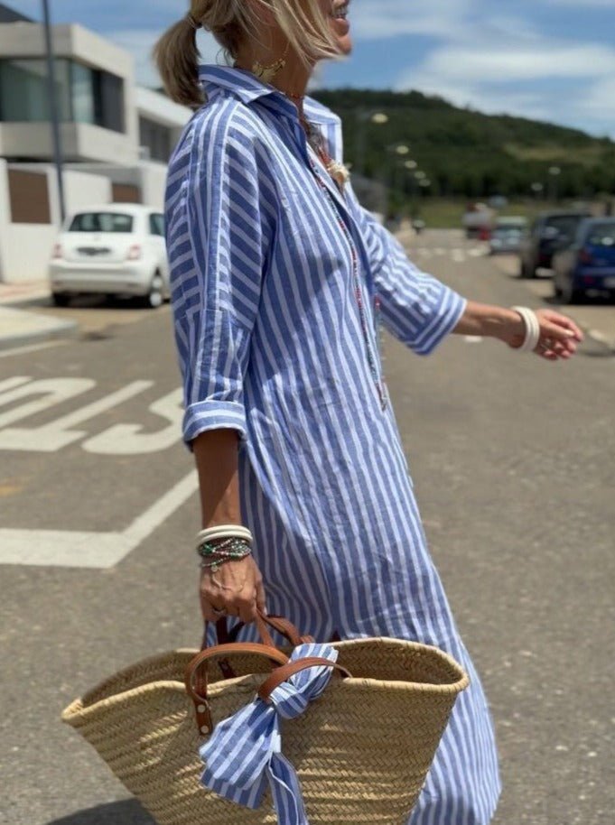 Vestito a righe midi donna con bottoni frontali, design casual chic ideale per outfit da ufficio o tempo libero.