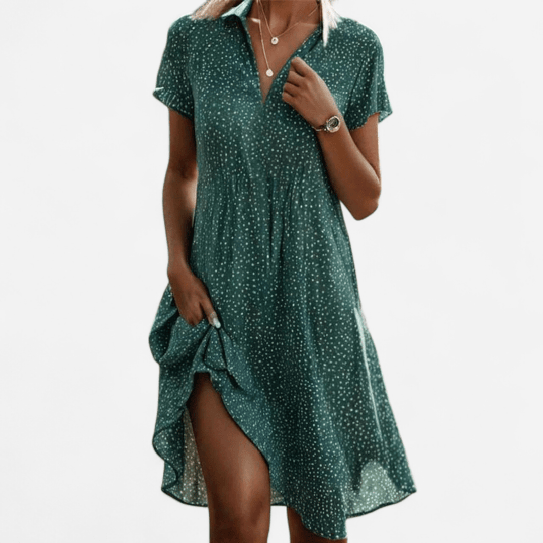 Abito elegante donna rosso a pois, colletto revers, lunghezza midi. Perfetto per occasioni speciali.