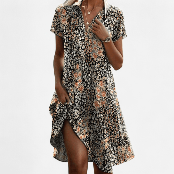 Abito donna midi elegante a pois, scollo a V, colletto revers. Stile fluido per ogni occasione.
