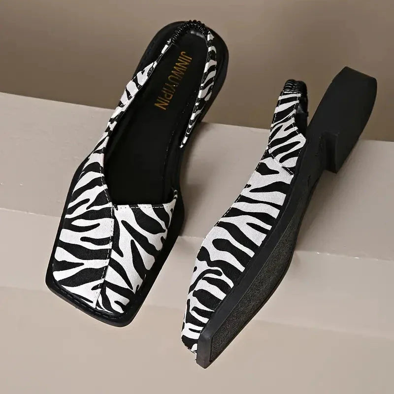 Scarpe comode e chic da donna, modello slip-on in pelle, perfette per lunghe giornate.
