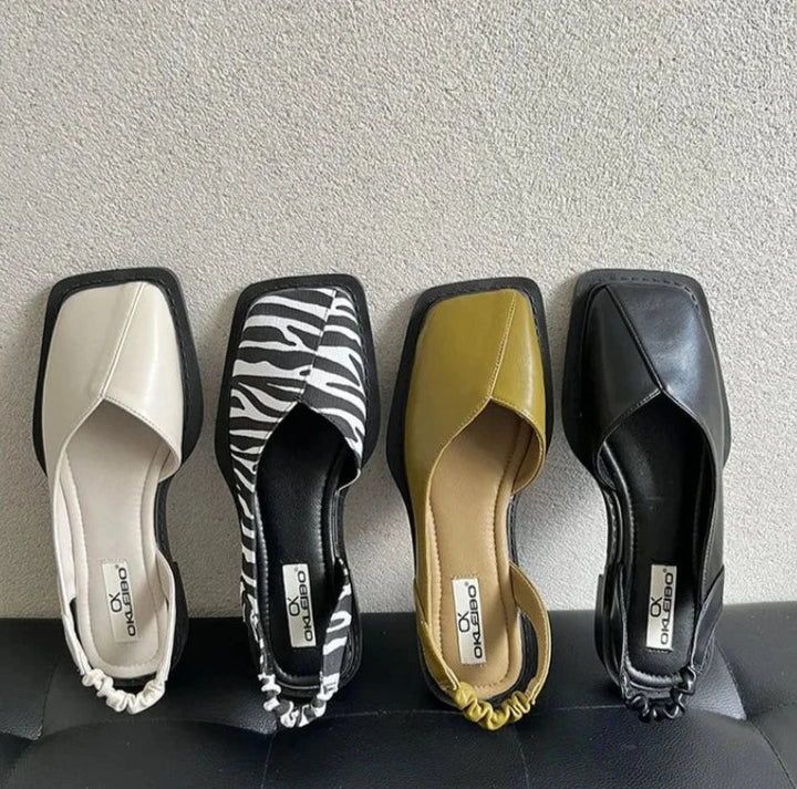 Scarpe basse slip-on da donna in pelle, ideali per comfort elegante quotidiano.