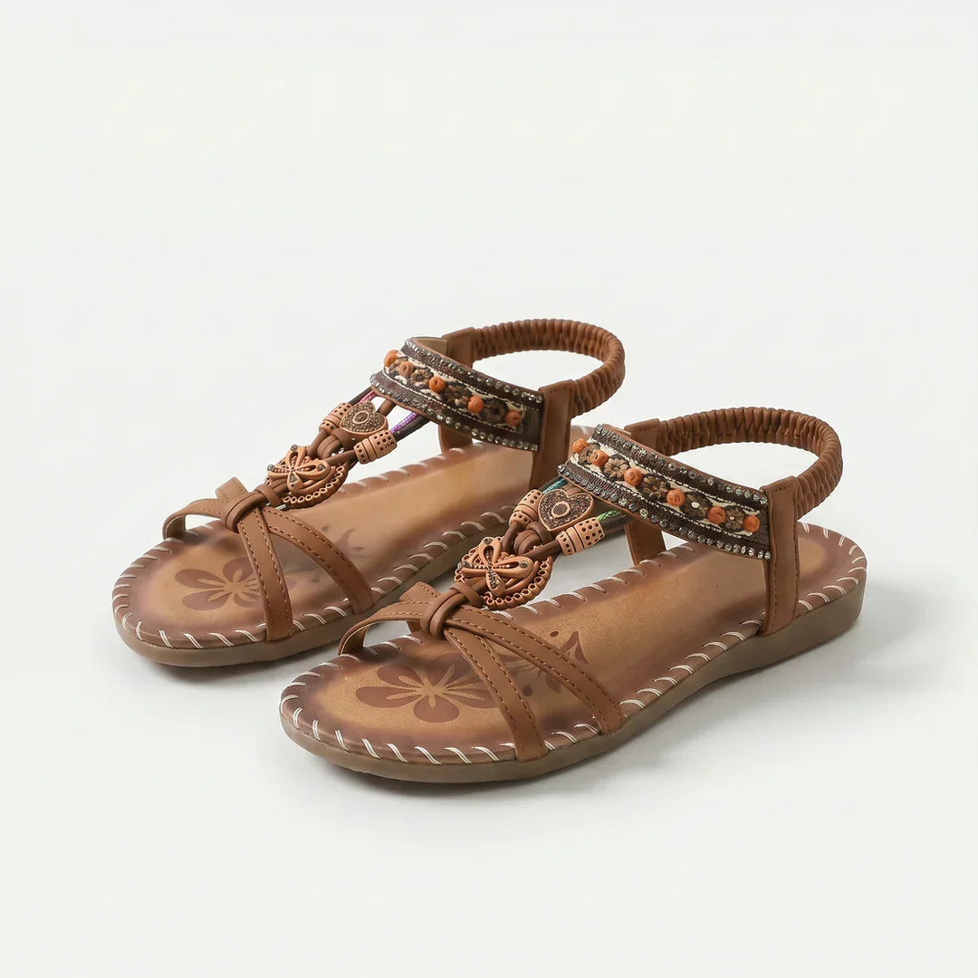 Infradito donna chic con perline brillanti e vivace suola floreale, il tocco finale per il tuo look estivo.