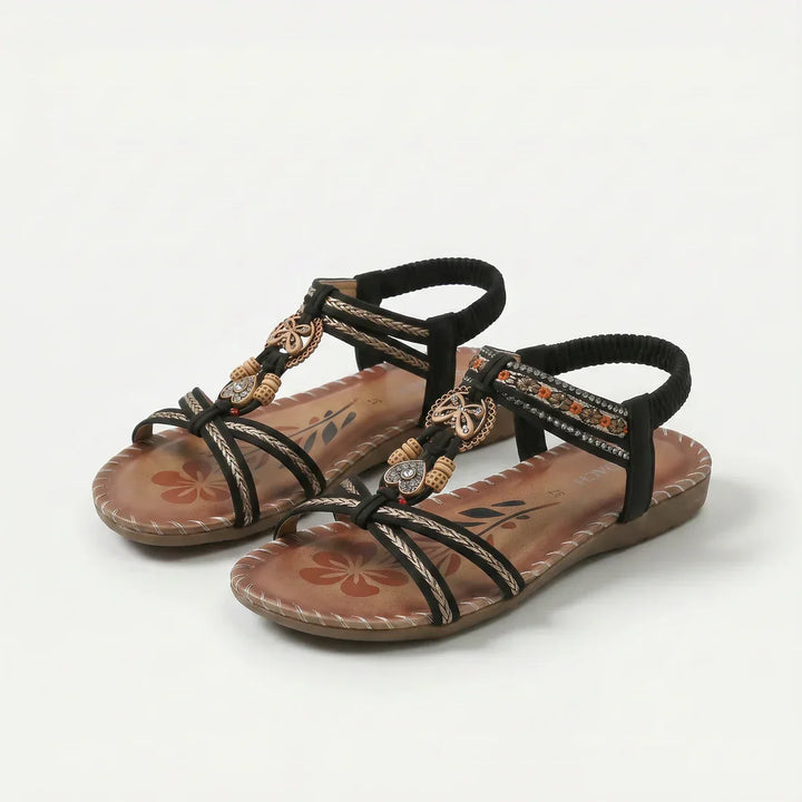 Sandali infradito da donna, stile estivo con perline e suola floreale, ideali per comfort e moda in vacanza.