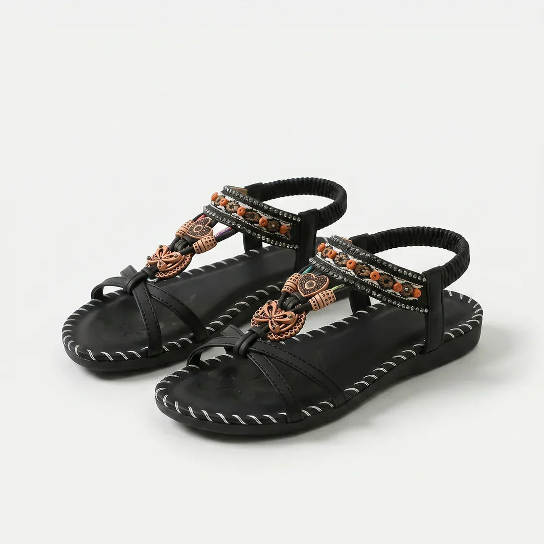 Scarpe estive donna: infradito con perline, comoda suola floreale, perfette per vacanze al mare.