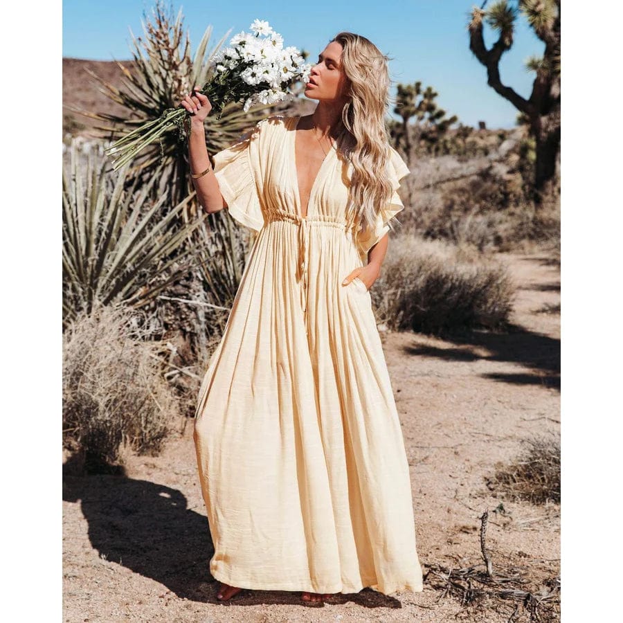 Vestito estivo donna color crema, stile Ibiza. Elegante e versatile per spiaggia o serate rilassate.