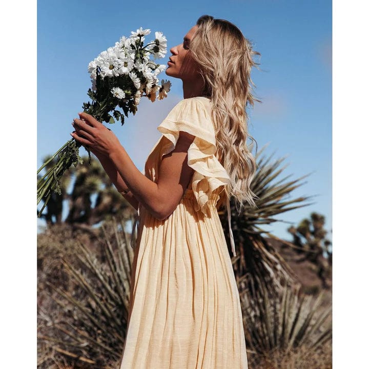 Abito lungo donna color crema, stile Ibiza. Eleganza estiva rilassata, ideale per un look versatile in spiaggia.