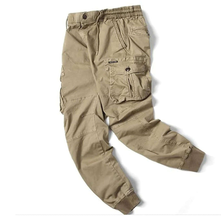 Jogger cargo uomo grigi, stile moderno e sportivo, con ampie tasche laterali per il tempo libero.