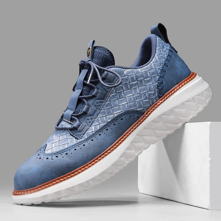 Sneakers eleganti uomo ibride, design brogue e pannelli intrecciati. Comfort e stile casual chic per moda maschile.