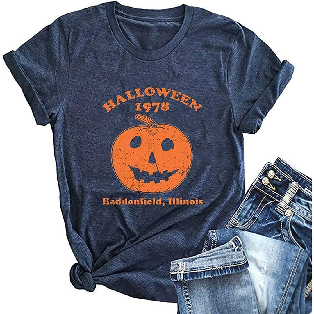 T-shirt uomo nera Halloween con grafica zucca horror distressed. Girocollo, perfetta per feste o stile casual spettrale.