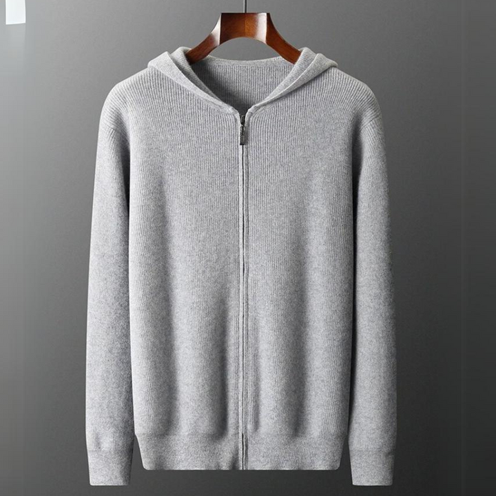 Felpa uomo grigia con cappuccio e zip, perfetta per comfort casual autunnale. Polsini a costine.