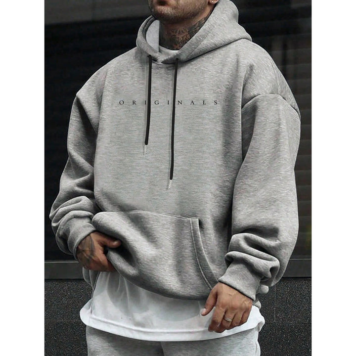 Felpa con cappuccio oversize da uomo, essenziale per comfort e moda casual in primavera/autunno.