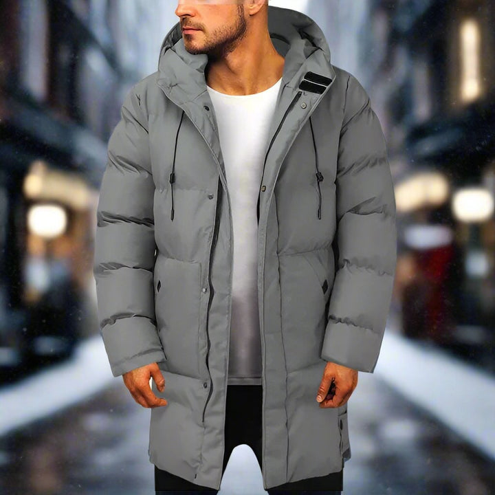 Cappotto invernale uomo puffer trapuntato con cappuccio regolabile. Giacca calda per il freddo.