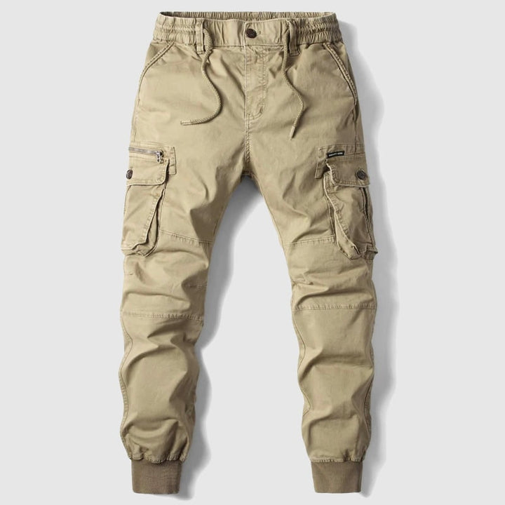 Jogger uomo slim fit grigi, stile cargo con tasche laterali e coulisse. Perfetti per outfit alla moda maschile.