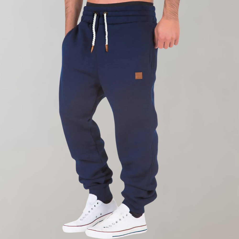 Joggers da uomo grigi, perfetti per sport e tempo libero, con coulisse e polsini a costine per massimo comfort e stile casual.